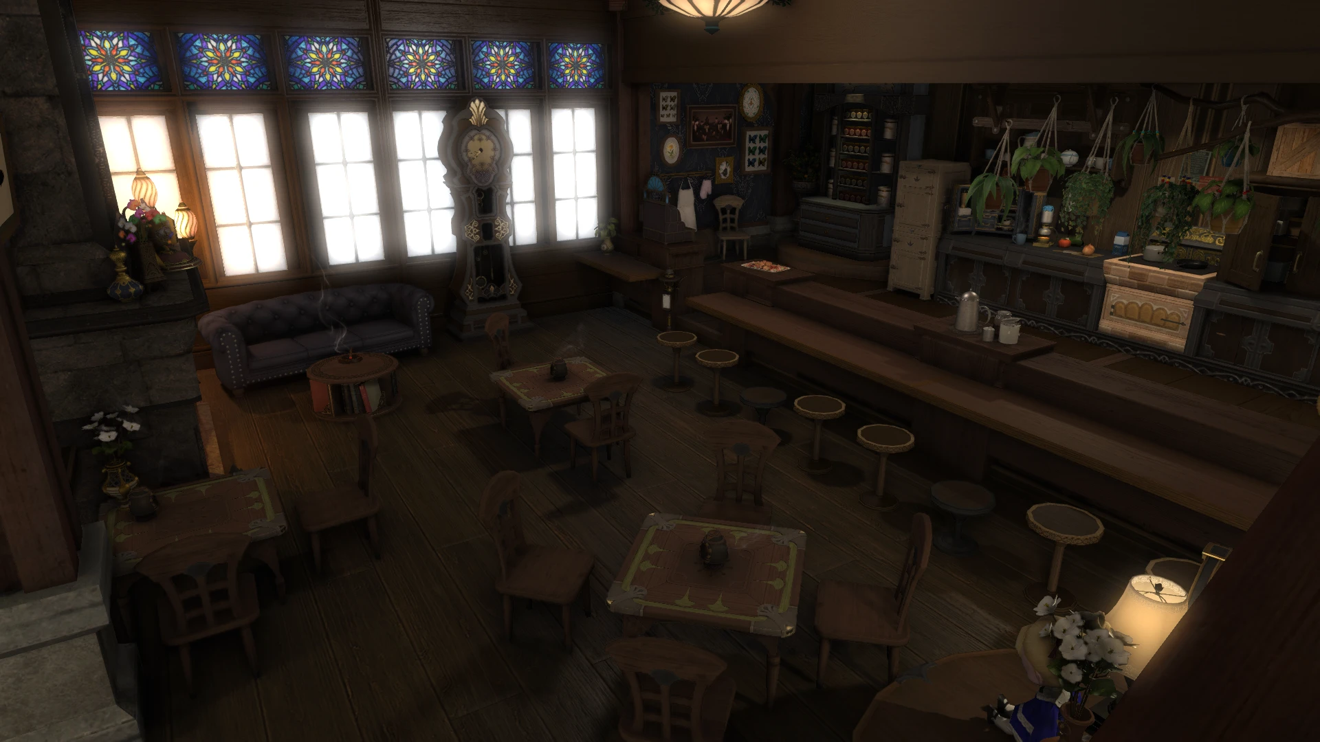 A small cafe with a bar and a few tables. There's big windows with stained glass accents on the back wall that light up the room.